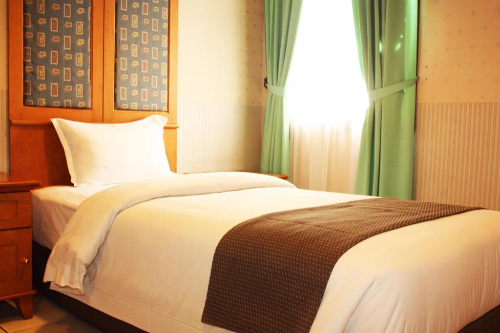 Travellers Suites Serviced Apartments Μεντάν Δωμάτιο φωτογραφία