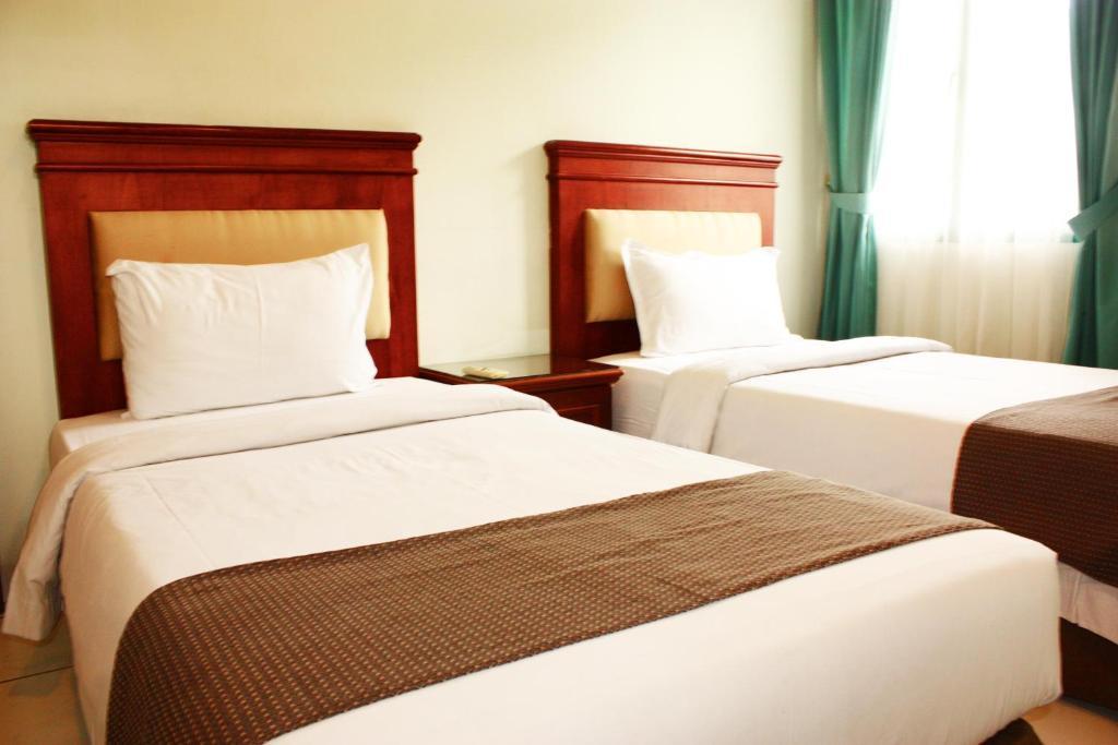 Travellers Suites Serviced Apartments Μεντάν Δωμάτιο φωτογραφία